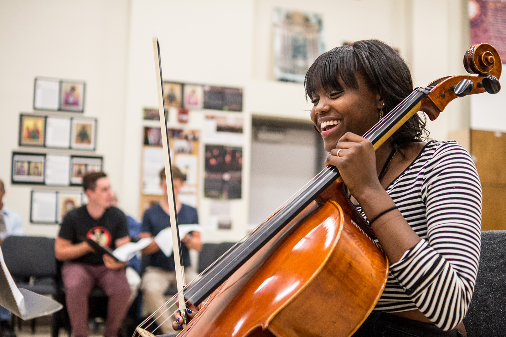 Choir student playing string instrument